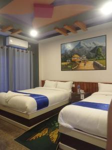 Postel nebo postele na pokoji v ubytování Hotel Namo Buddha