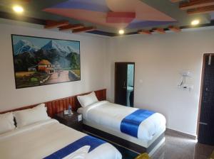 Postel nebo postele na pokoji v ubytování Hotel Namo Buddha