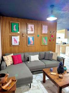 a living room with a couch and a table at Departamento Vista Lago de Pátzcuaro in Pátzcuaro