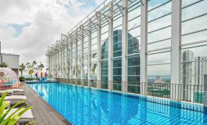 a swimming pool on the top of a building at Shama Suasana Johor Bahru Formerly known as Suasana All Suites Hotels Johor Bahru in Johor Bahru