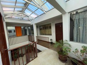 a balcony with a skylight in a house at Hostal Palma in Cuenca