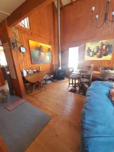 a living room with a couch and a table at Casa Lago Ranco in Lago Ranco