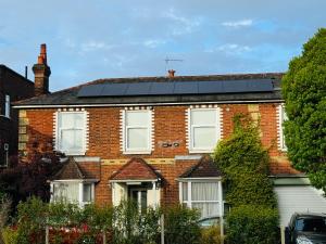 a brick house with solar panels on the roof at The Bliss 9 Home Stay, En-suite, Self check in with smart lock, Non Smoking Home in and out, Zero tolerance for noise after 11pm in Southampton
