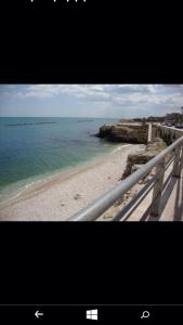a view of a beach with the ocean at B&B Numero Uno in Bisceglie