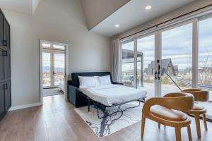 a bedroom with a bed and a large window at Stardust Big Bend Luxury A-Frame#1 with a fab view in Terlingua