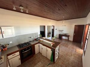 an overhead view of a kitchen with a stove top oven at La Plage in Nosy Be