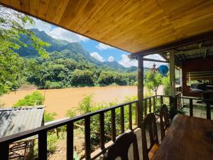a view from the porch of a house overlooking a river at Nong Khiaw Ing Ing Mountain View in Nongkhiaw