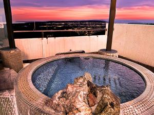 a hot tub on top of a building at Takasago Onsen in Asahikawa +37 photos