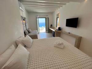 Cama ou camas em um quarto em Paolas Sunset
