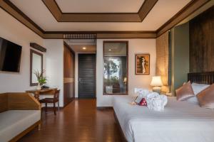 Ein Bett oder Betten in einem Zimmer der Unterkunft Anda Lanta Resort