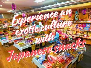 a store with a sign that reads experience all edible culture with pancakes snacks at Takasago Onsen in Asahikawa