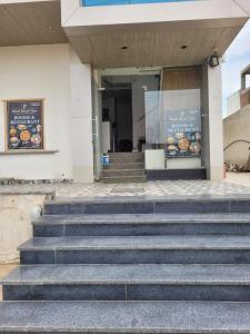 a set of stairs in front of a building at Hotel Royal Vilas in Bharatpur