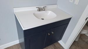 a bathroom sink with a black and white counter at 068D Newly Remodeled Cozy Studio South Rim in Valle