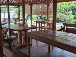 a group of tables and chairs in a restaurant at Omah Pinter in Beran-kidul