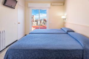 Postel nebo postele na pokoji v ubytování Hostal Solimar