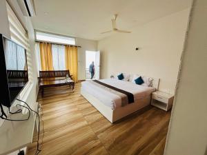 Letto o letti in una camera di WM Resorts