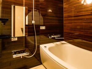 a bathroom with a sink and a bath tub at Many Thanks Resort Onomichi - Vacation STAY 15792 in Onomichi +24 photos