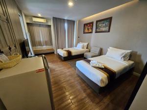 Postel nebo postele na pokoji v ubytování Bright Hotel