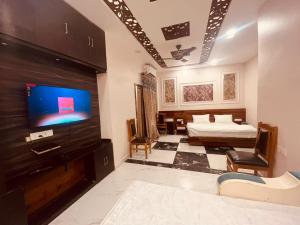 Postelja oz. postelje v sobi nastanitve Hotel Ram Anandam Inn