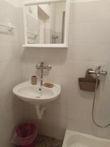 a bathroom with a sink and a mirror and a toilet at Vake in Herceg-Novi +28 photos