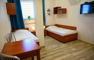 Posteľ alebo postele v izbe v ubytovaní Noclegi GALESZ