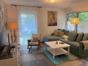 a living room with a couch and a table at Sonnenbergs Quartier in Erbach