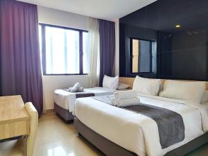 Voodi või voodid majutusasutuse Genting SunriseColdInn2R2B AT Ion Delemen toas +50 fotot