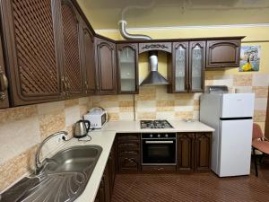 Kuchyň nebo kuchyňský kout v ubytování Guest House Na Suvorova