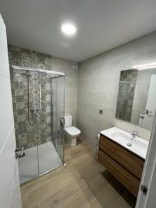 a bathroom with a shower and a sink and a toilet at Ca l'Artigalas in Cardona +44 photos