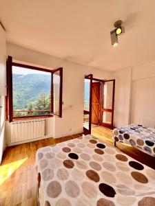 Postel nebo postele na pokoji v ubytování Chalet Del Bosco - Piccola Svizzera
