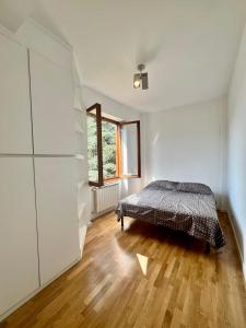Postel nebo postele na pokoji v ubytování Chalet Del Bosco - Piccola Svizzera