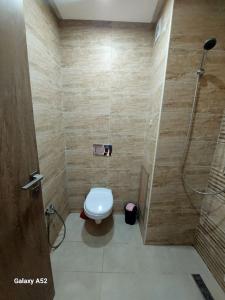 a bathroom with a toilet and a shower at Appartement de standing à EZZAHRA in Ez Zahra +12 photos