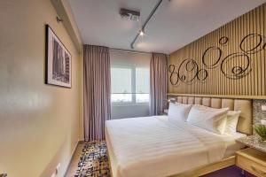 The Connor Serviced Residences Managed by HIIにあるベッド
