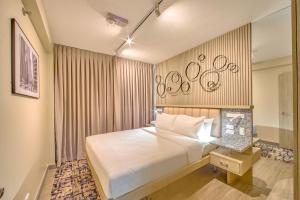 The Connor Serviced Residences Managed by HIIにあるベッド
