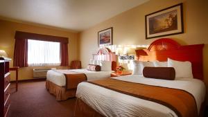 Postel nebo postele na pokoji v ubytování Best Western Plus Graham Inn