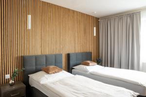 Ліжко або ліжка в номері Hotel Sharingham