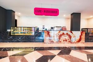 a restaurant with a sign that reads cafe privilege at Granada Luxury Red Adult Only in Alanya