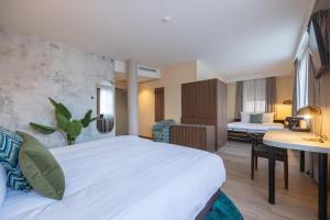 Postel nebo postele na pokoji v ubytování Leonardo Hotel Breda City Center