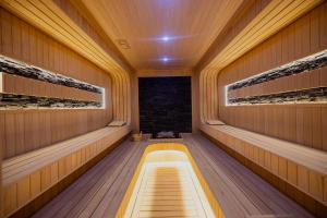 an empty sauna with a light at the end at Granada Luxury Red Adult Only in Alanya