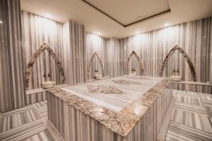 a room with a bed in the middle of it at Granada Luxury Red Adult Only in Alanya