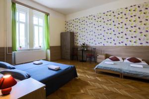 A bed or beds in a room at East Station Private Rooms