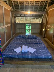 Postel nebo postele na pokoji v ubytování Nặm tha homestay