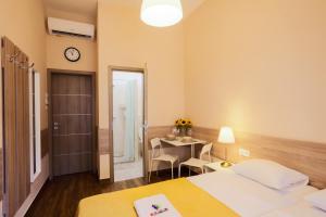 Posteľ alebo postele v izbe v ubytovaní East Station DeLuxe