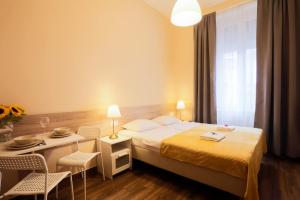 Posteľ alebo postele v izbe v ubytovaní East Station DeLuxe