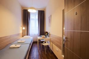 Posteľ alebo postele v izbe v ubytovaní East Station DeLuxe