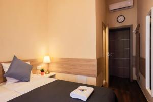 Posteľ alebo postele v izbe v ubytovaní East Station DeLuxe