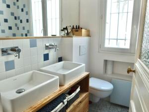 a bathroom with a sink and a toilet at Loft style condo 4 people in central and trendy Paris in Paris