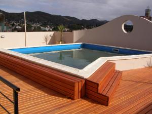 a swimming pool on the roof of a house at Apartamento Edificio Atlantis I in Villa Carlos Paz