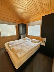 Postel nebo postele na pokoji v ubytování Arctic Home Experience + 22 fotografií
