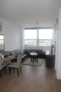 a living room with a couch and a table at Flat 414 One bedroom apartment in Birmingham